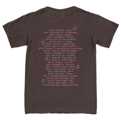 Brown t-shirt with a list of dates and locations printed on the back.