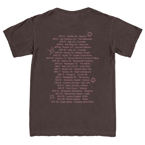 Brown t-shirt with a list of dates and locations printed on the back.